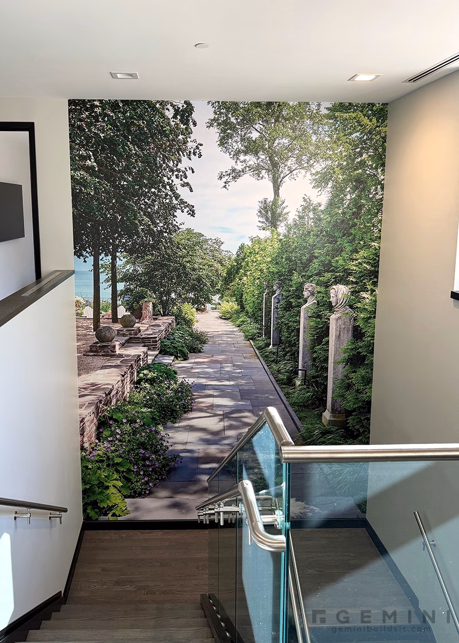 Floor-to-ceiling landscape wall mural installed in the Mariani Design Studio stairwell