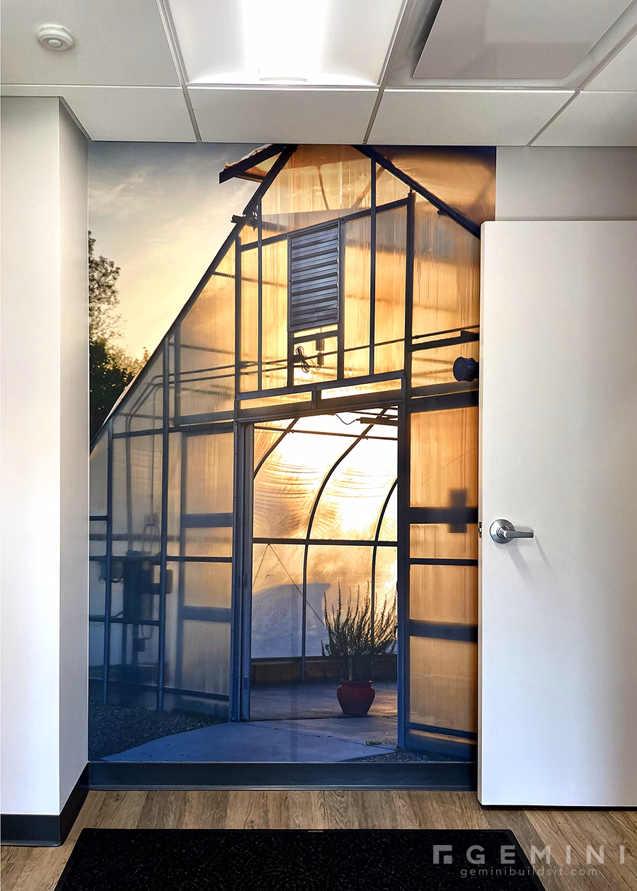 Floor-to-ceiling greenhouse wall mural at Mariani Design Studio in Lake Forest