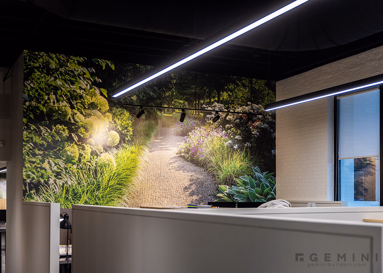 Large-format garden wall mural featuring a Mariani landscape project in the design studio